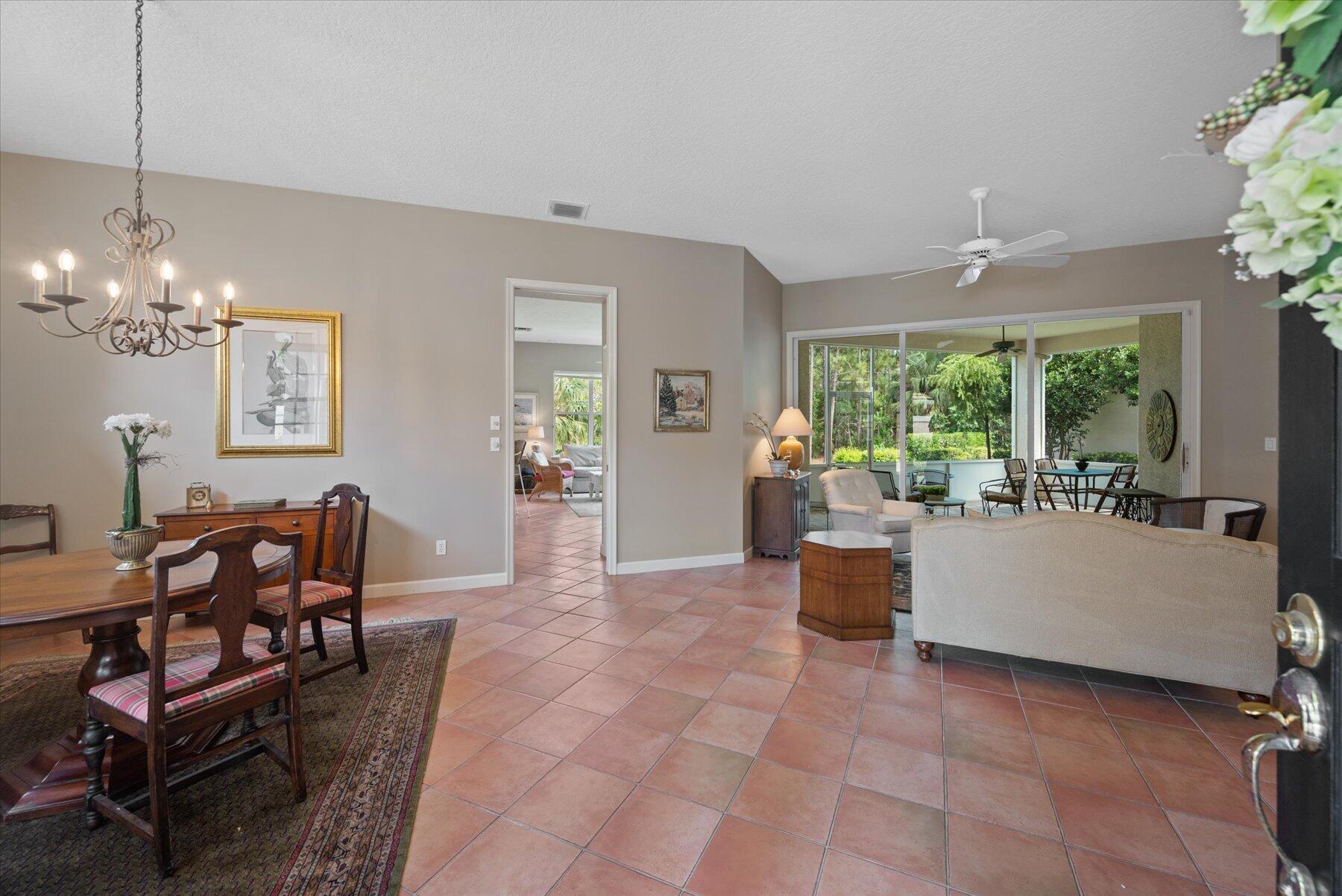 3498 Southeast Doubleton Drive Stuart, FL 34997 - Photo 4 of 42 a living room with furniture and a large window