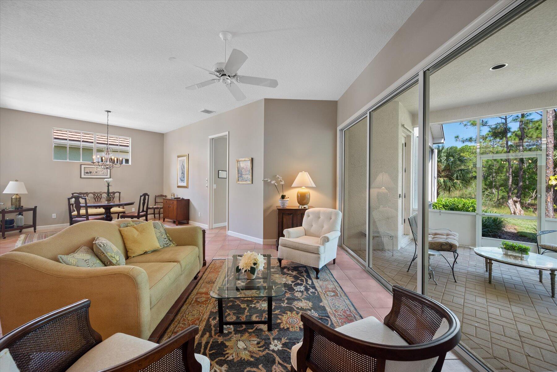3498 Southeast Doubleton Drive Stuart, FL 34997 - Photo 5 of 42 a living room with furniture and a large window