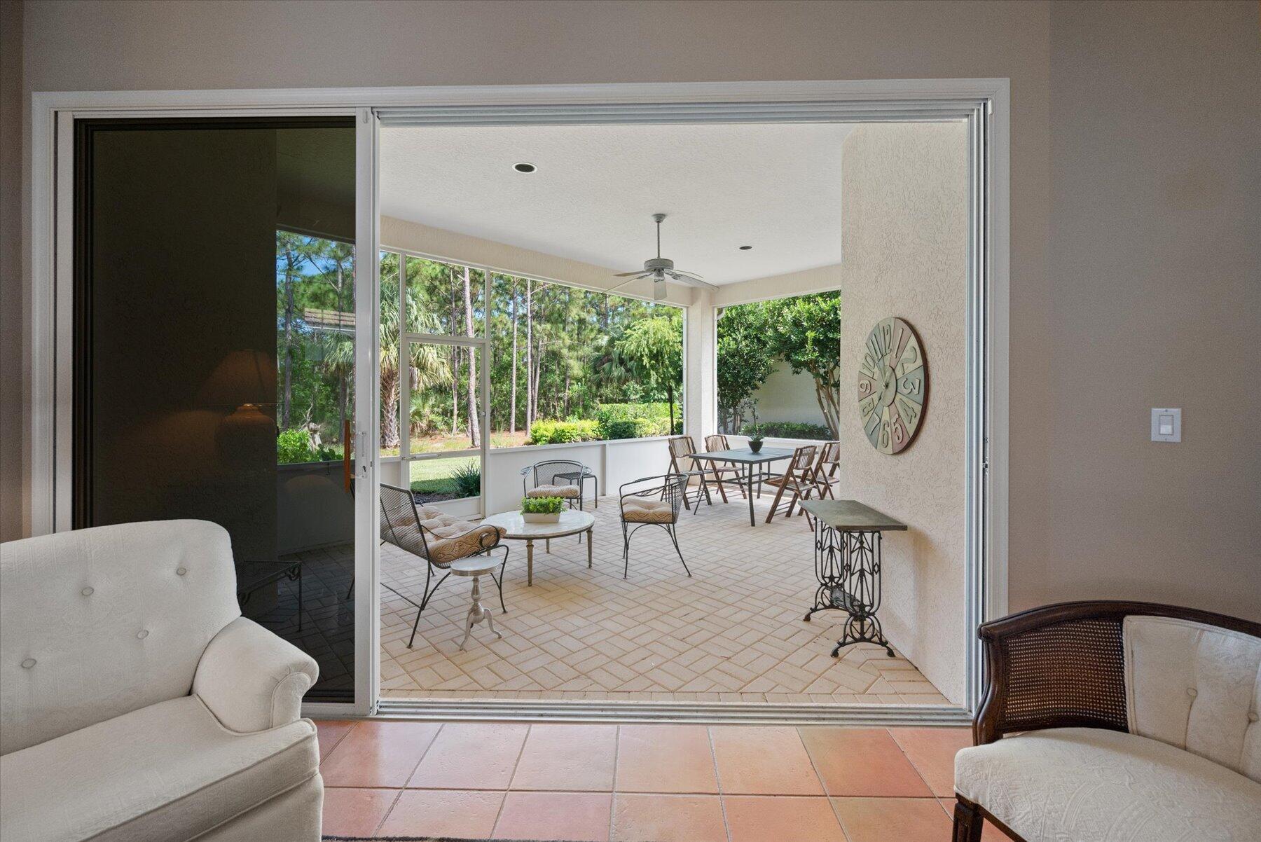 3498 Southeast Doubleton Drive Stuart, FL 34997 - Photo 9 of 42 a dining room with furniture and a large window