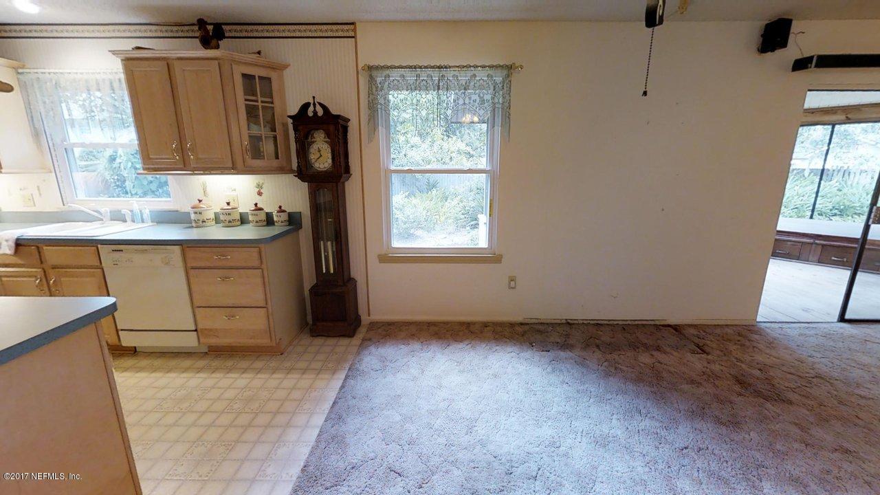 121 Osage Road St. Augustine, FL 32086 - Photo 4 of 23 a view of walk in closet with clothes and shoes