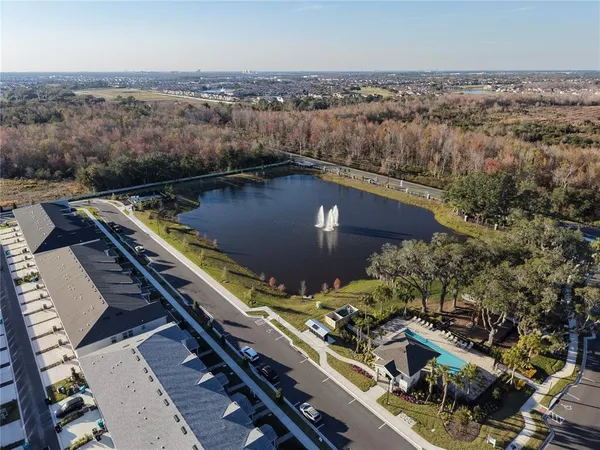 an aerial view of a residential houses with outdoor space