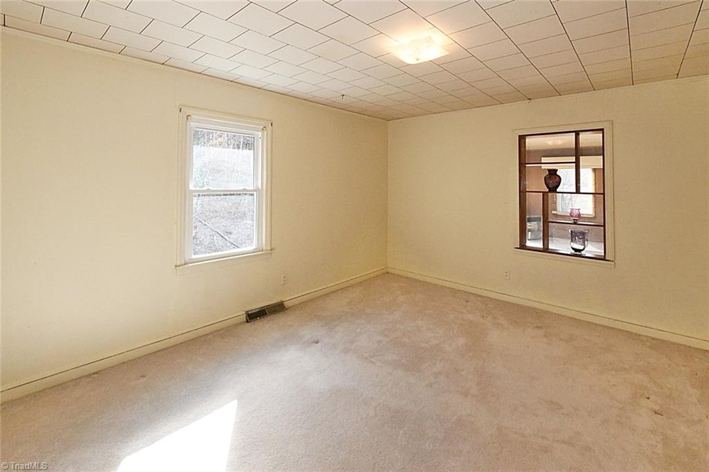 2442 Collinstown Road Westfield, NC 27053 - Photo 22 of 30 2nd Bedroom Carpeted But Likely has Hardwood Floors Also.