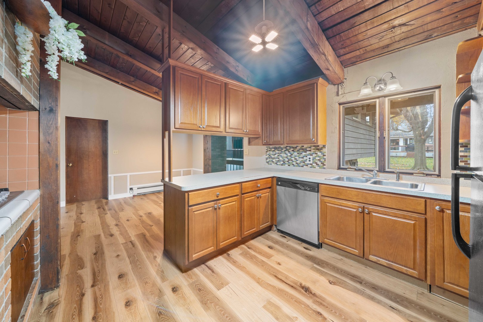 707 East Prairie Street Plano, IL 60545 - Photo 11 of 30 a large kitchen with stainless steel appliances granite countertop a sink and cabinets
