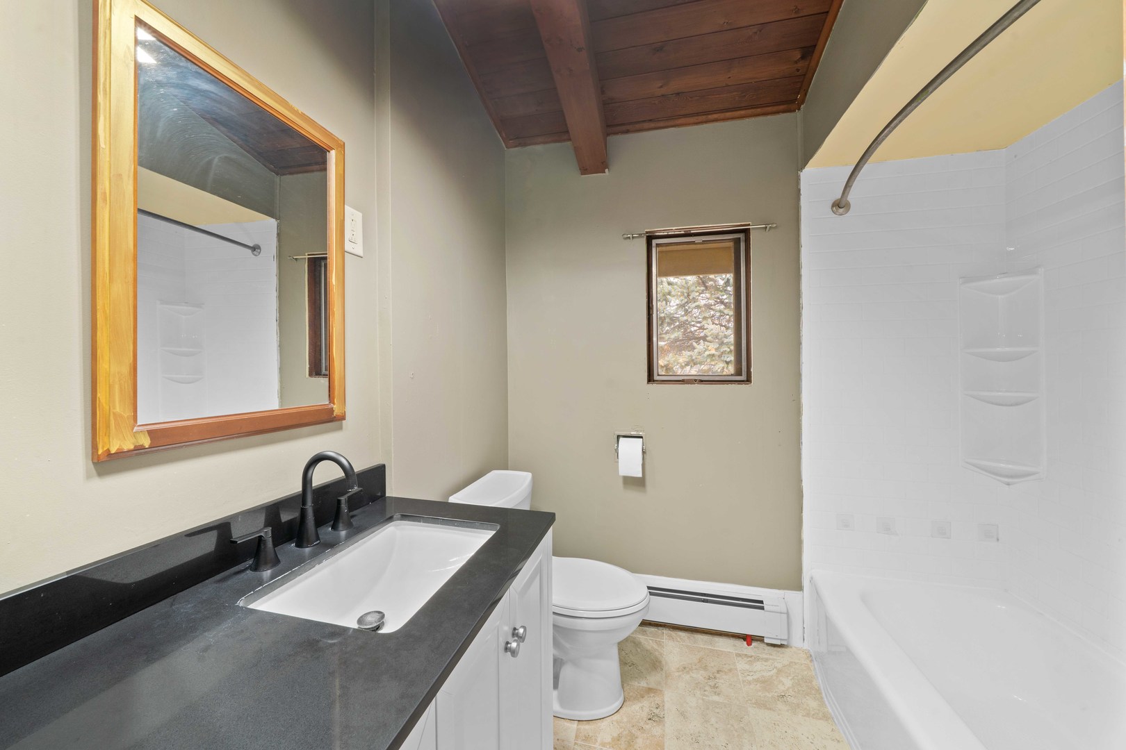 707 East Prairie Street Plano, IL 60545 - Photo 12 of 30 a bath room with a toilet a sink and a mirror