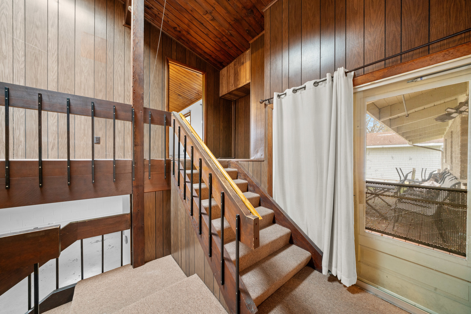 707 East Prairie Street Plano, IL 60545 - Photo 17 of 30 a view of staircase with lots of frames on wall and frames on wall