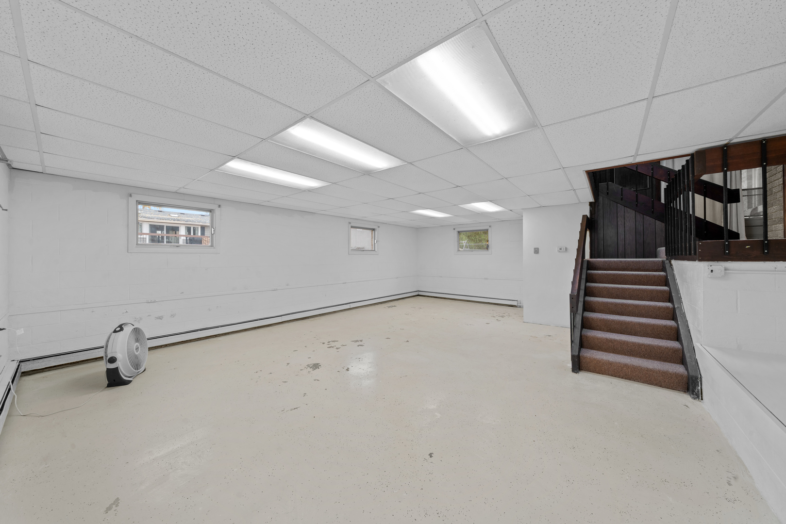 707 East Prairie Street Plano, IL 60545 - Photo 22 of 30 an empty room with windows and stairs