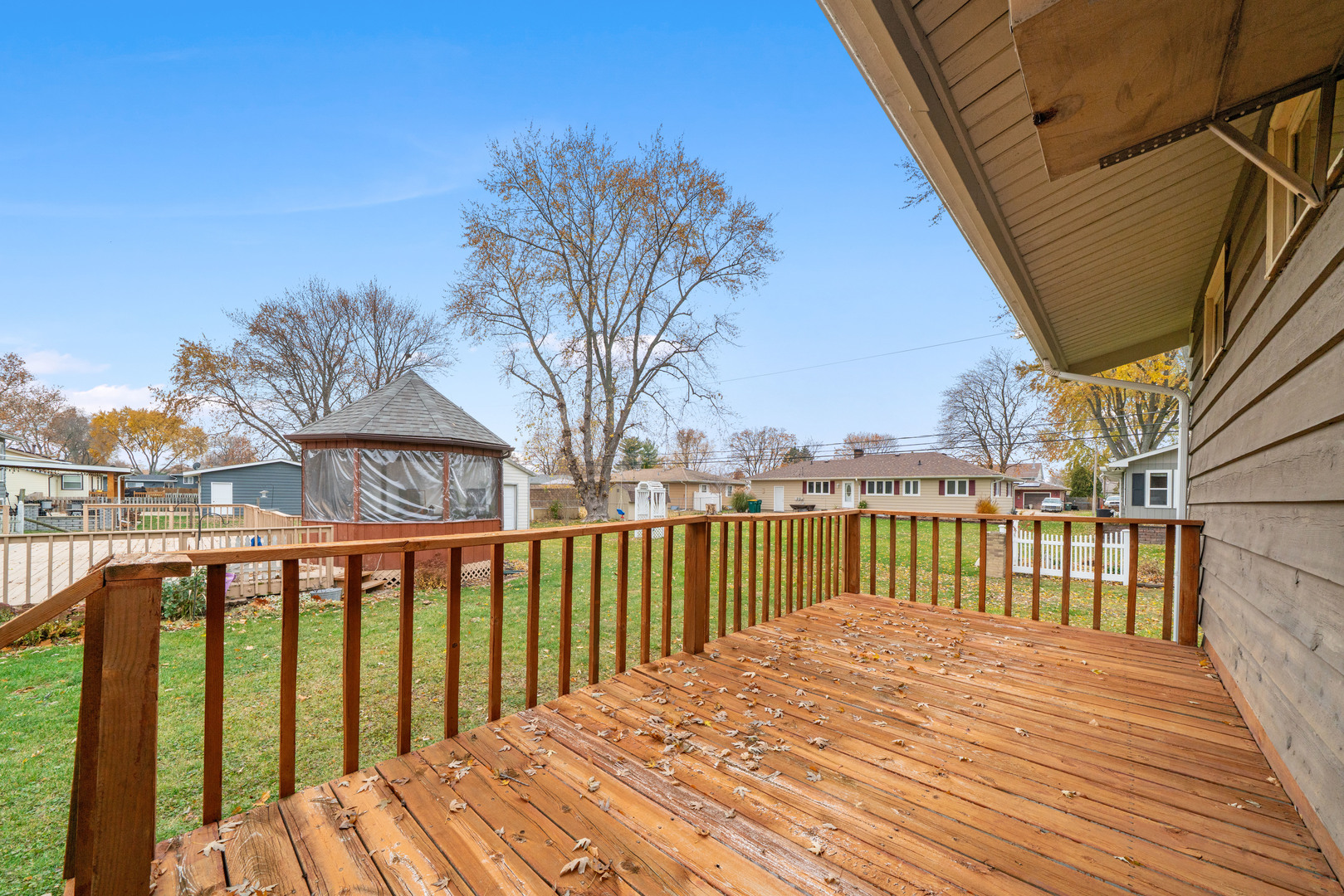 707 East Prairie Street Plano, IL 60545 - Photo 25 of 30 a view of balcony with wooden floor and fence