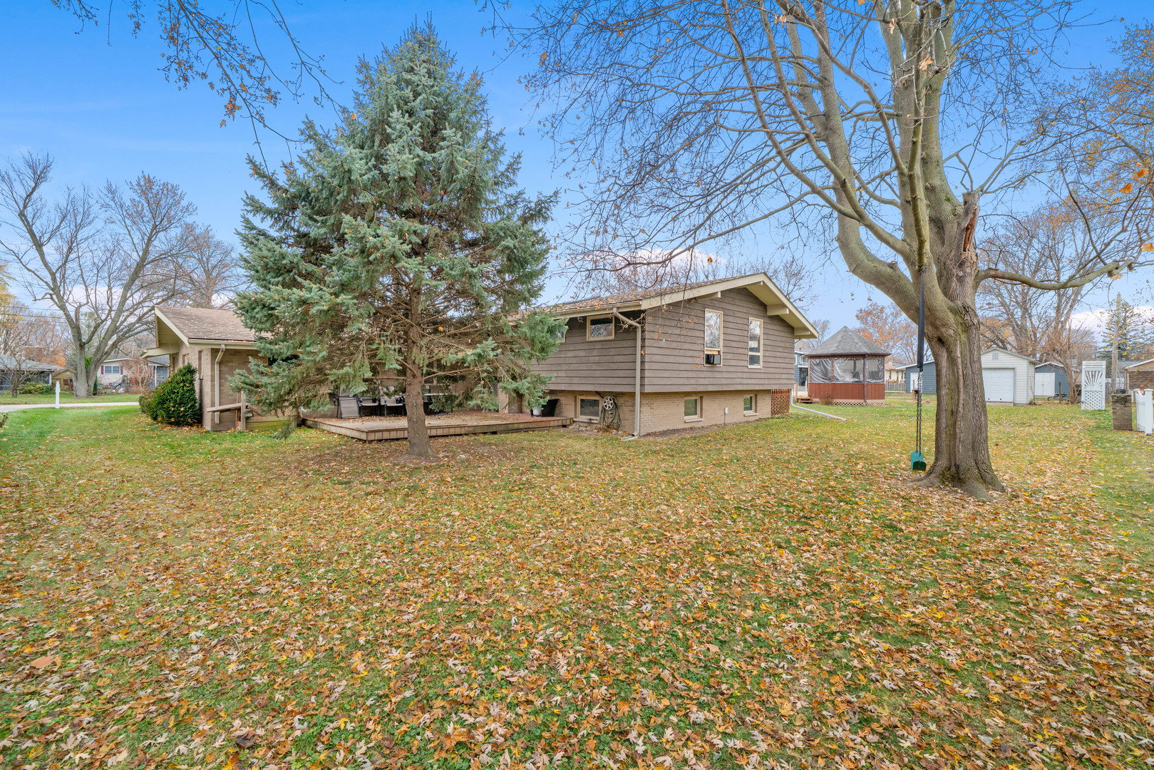 707 East Prairie Street Plano, IL 60545 - Photo 29 of 30 a view of a house with a yard