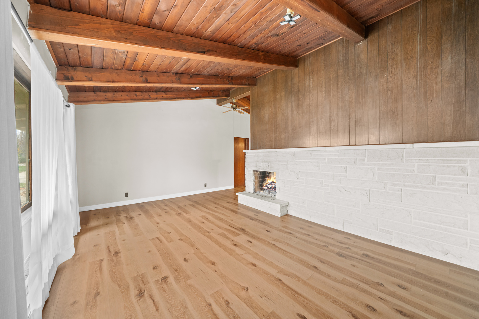 707 East Prairie Street Plano, IL 60545 - Photo 3 of 30 a view of empty room with wooden floor