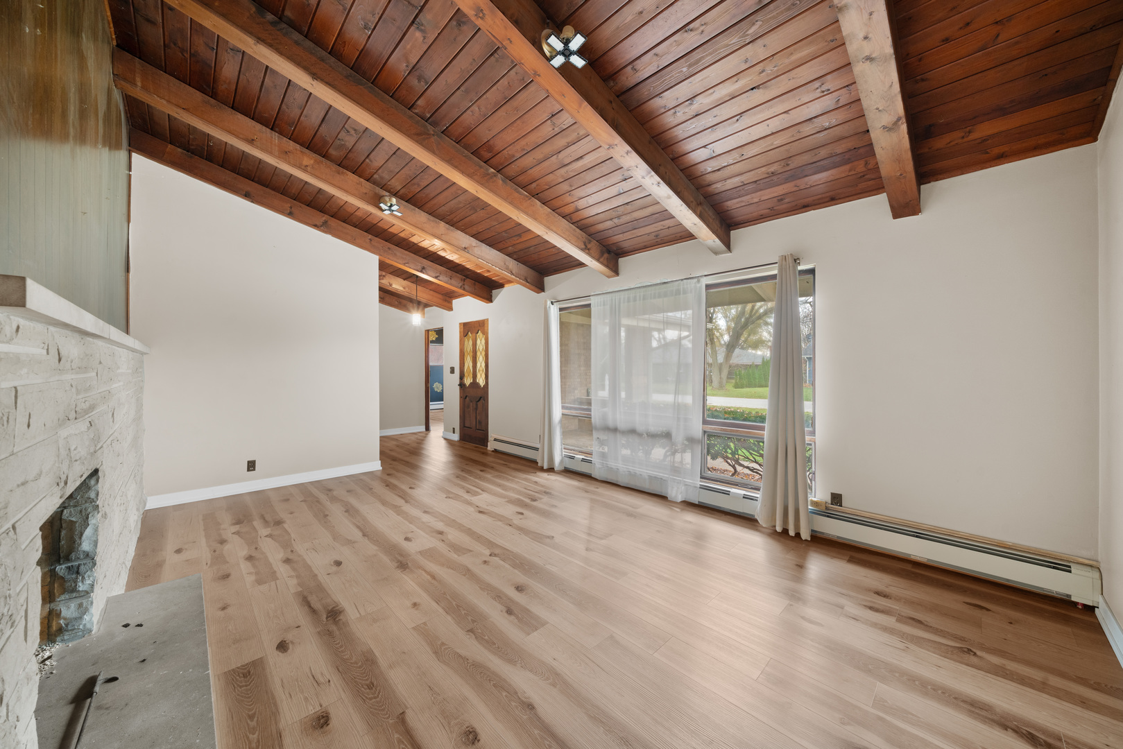 707 East Prairie Street Plano, IL 60545 - Photo 5 of 30 a view of an empty room with wooden floor