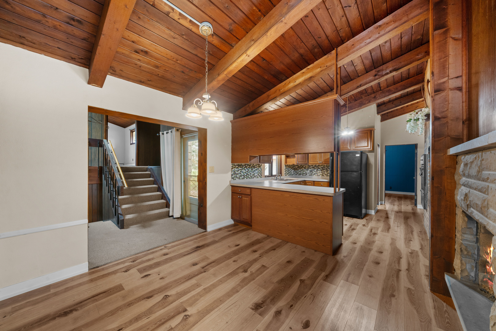 707 East Prairie Street Plano, IL 60545 - Photo 6 of 30 a view of a hallway with wooden floor and stairs