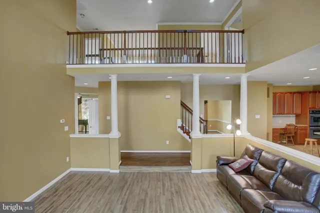 a view of an empty room with glass door and balcony