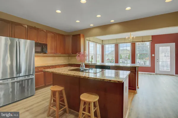 a kitchen with granite countertop lots of counter top space and dining table
