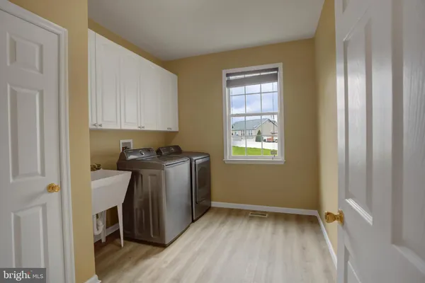 a bathroom with a tub shower and sink