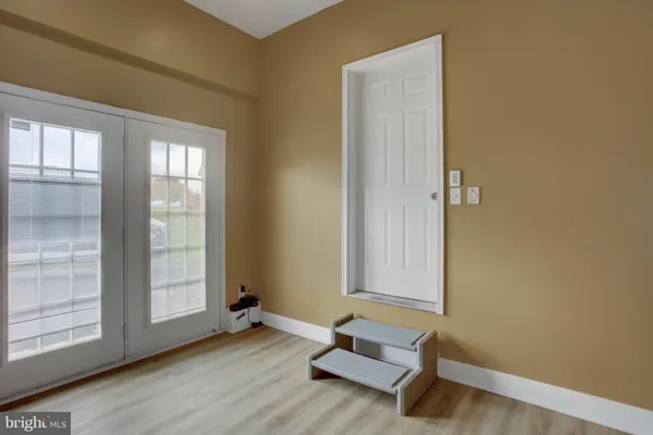 a view of walk in closet with clothes