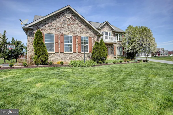 front view of a house with a yard