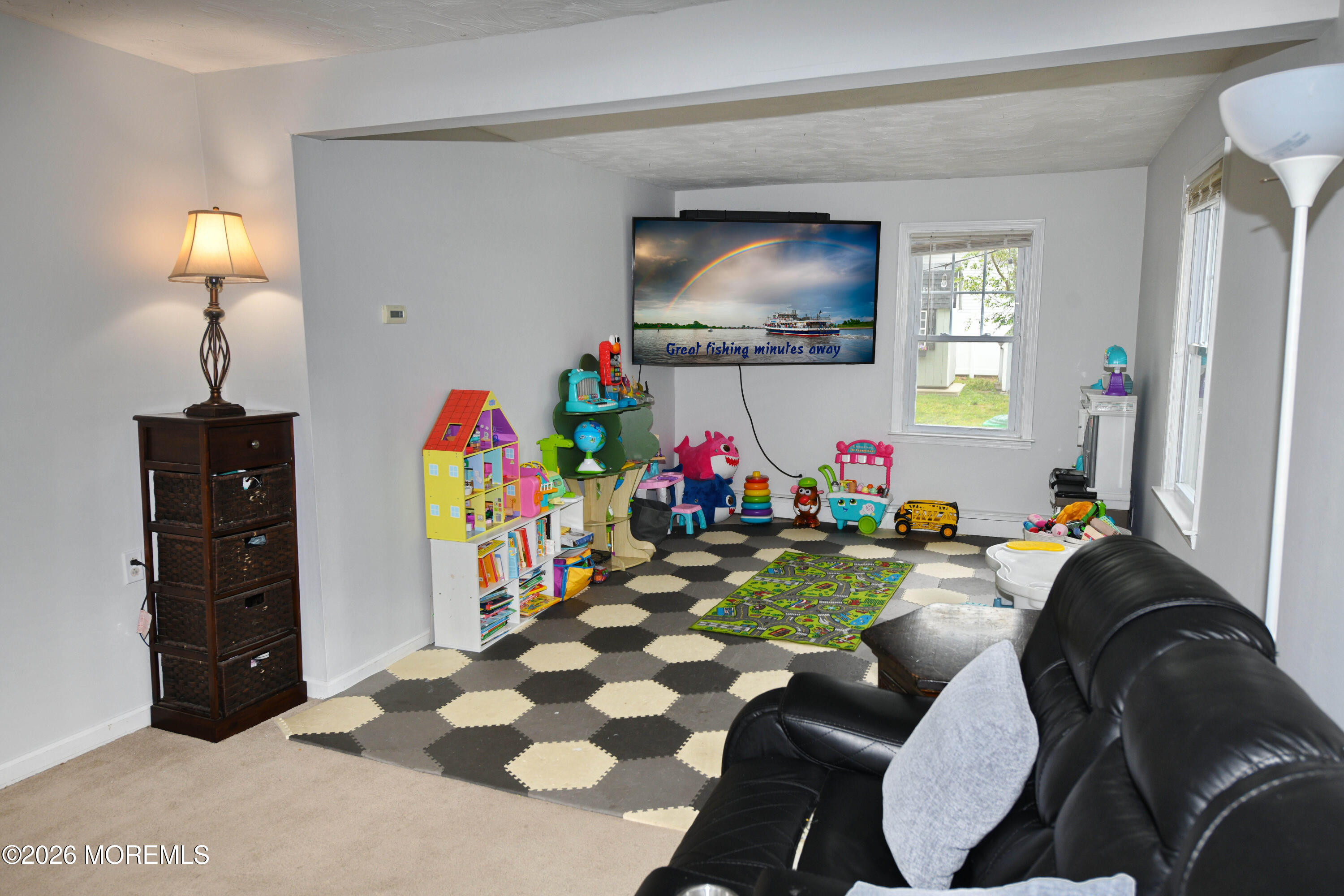 232 Pearce Avenue Point Pleasant, NJ 08742 - Photo 7 of 27 a living room with furniture and a flat screen tv