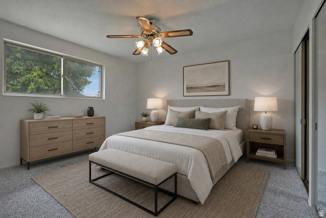 1722 Kimsbrough Road Sandy, UT 84092 - Photo 14 of 29 Carpeted interior space featuring a large window, a built-in closet with sliding doors, a ceiling fan with integrated lighting, and neutral wall tones