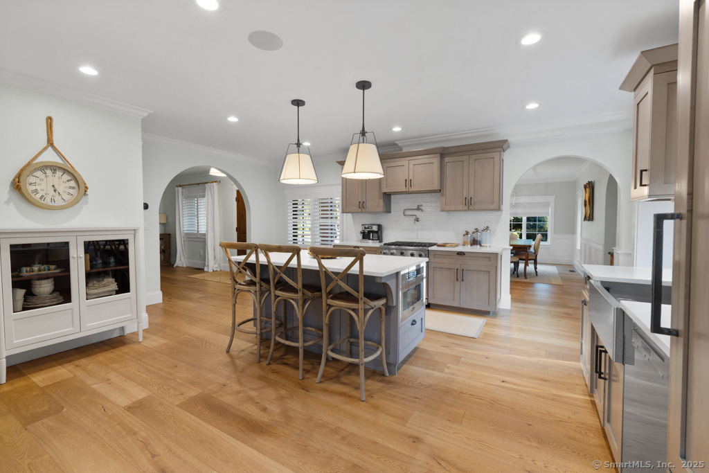 93 East Meadow Road Wilton, CT 06897 - Photo 12 of 35 a large kitchen with a table and chairs in it