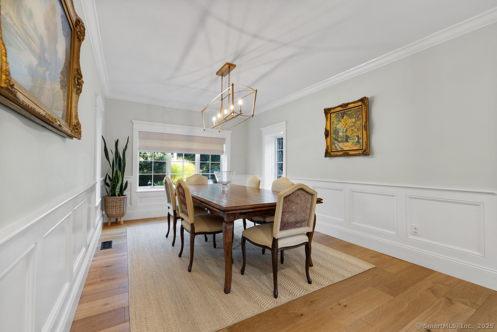 93 East Meadow Road Wilton, CT 06897 - Photo 14 of 35 a view of a dining room with furniture and wooden floor