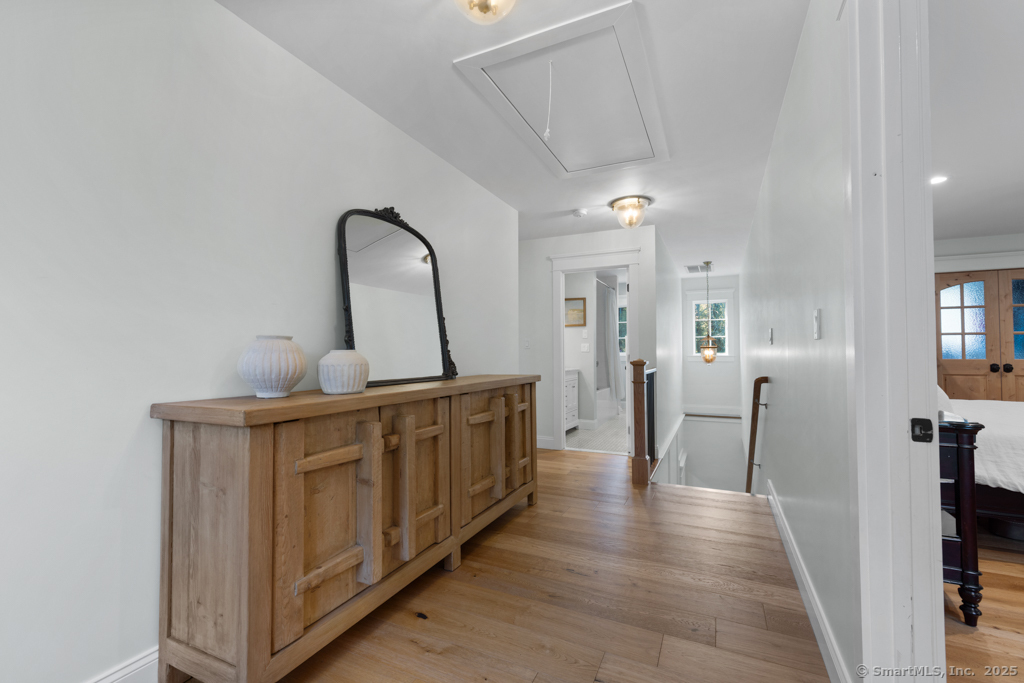 93 East Meadow Road Wilton, CT 06897 - Photo 18 of 35 a view of a hallway with windows