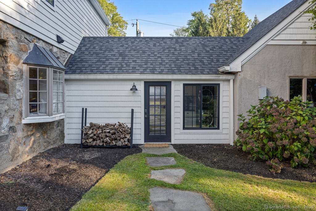 93 East Meadow Road Wilton, CT 06897 - Photo 29 of 35 a front view of a house with garden
