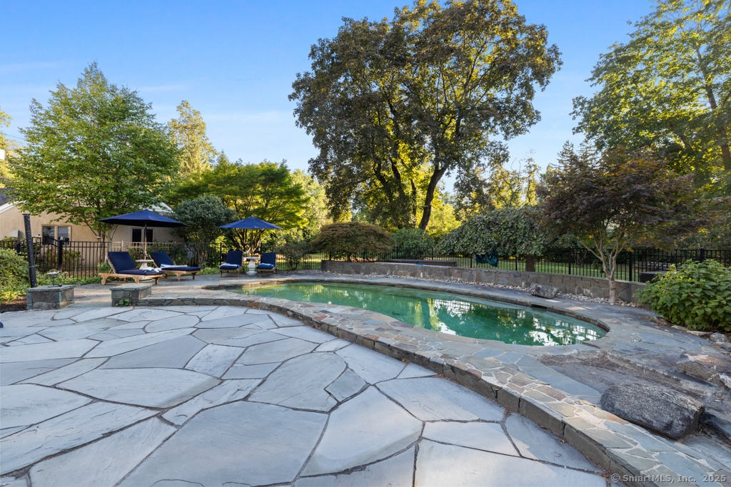 93 East Meadow Road Wilton, CT 06897 - Photo 3 of 35 a view of backyard with seating area and trees