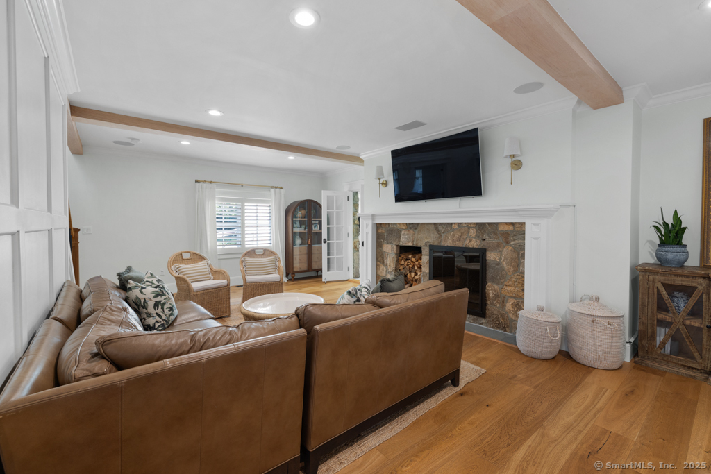 93 East Meadow Road Wilton, CT 06897 - Photo 5 of 35 a living room with furniture and a fireplace
