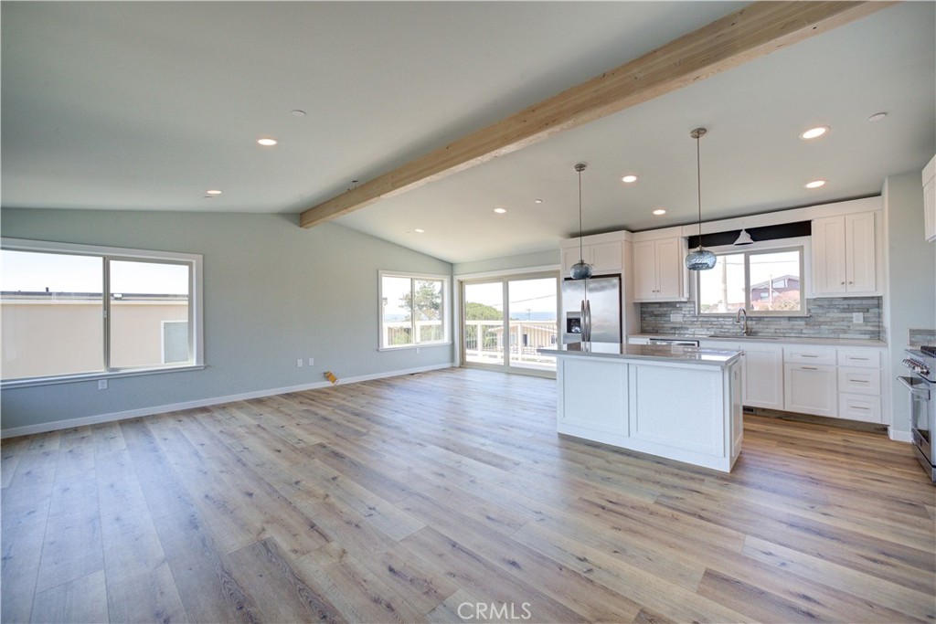 396 Castle Street Cambria, CA 93428 - Photo 16 of 74 a large kitchen with stainless steel appliances granite countertop a large counter top a sink and a dishwasher