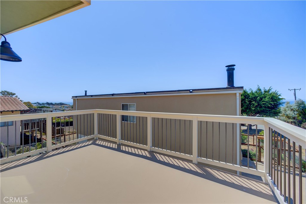 396 Castle Street Cambria, CA 93428 - Photo 40 of 74 a view of a house with a roof deck