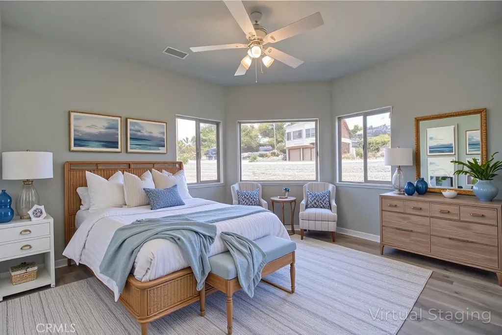 396 Castle Street Cambria, CA 93428 - Photo 47 of 74 a bedroom with a bed wooden floor and window