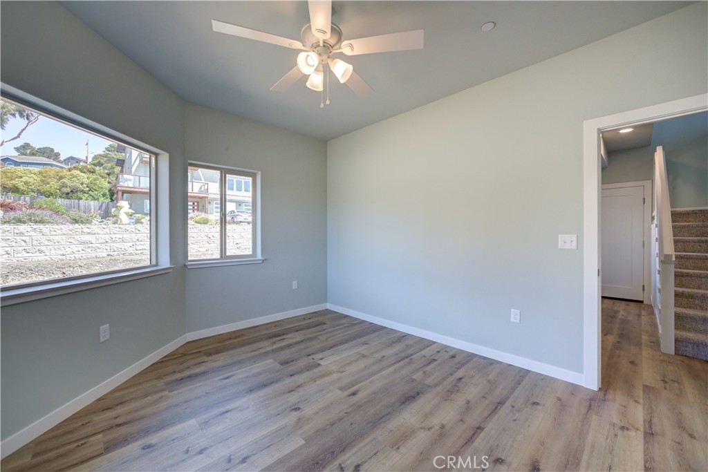 396 Castle Street Cambria, CA 93428 - Photo 50 of 74 wooden floor in an empty room with a window