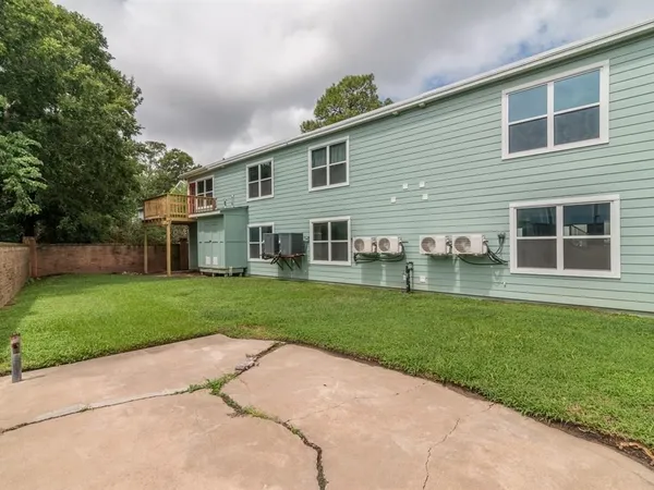 a front view of a house with a yard and porch