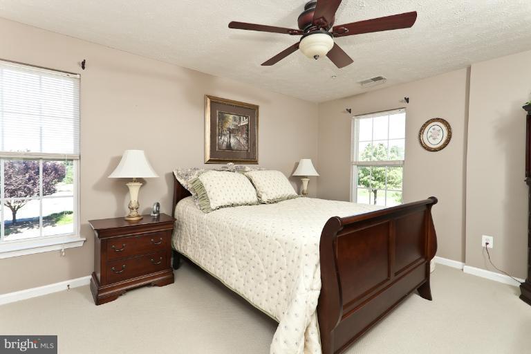 9604 Haven Farm Road, Unit 9604F Perry Hall, MD 21128 - Photo 15 of 19 a bedroom with a bed and a window