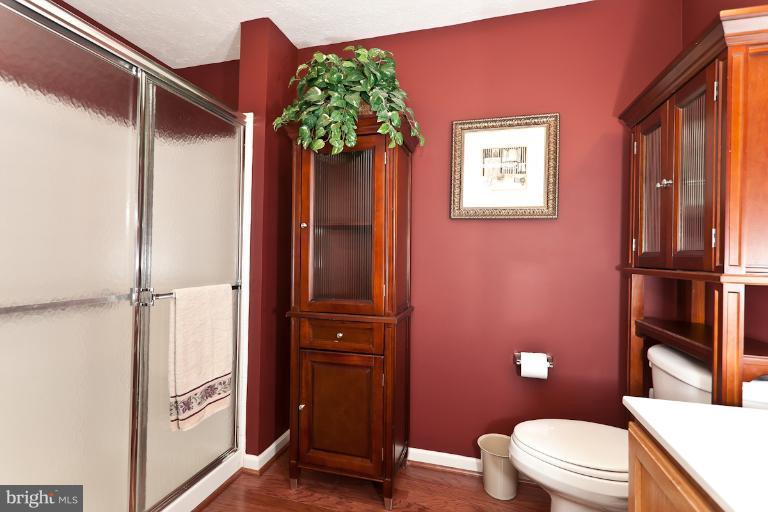 9604 Haven Farm Road, Unit 9604F Perry Hall, MD 21128 - Photo 16 of 19 a bathroom with a toilet a sink and tub