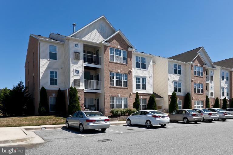 9604 Haven Farm Road, Unit 9604F Perry Hall, MD 21128 - Photo 9 of 19 a car parked in front of a building