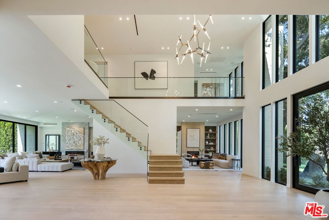 17055 Rancho Street Encino, CA 91316 - Photo 19 of 73 a view of hall way with living room and livingroom view