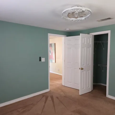 an empty room with a mirror