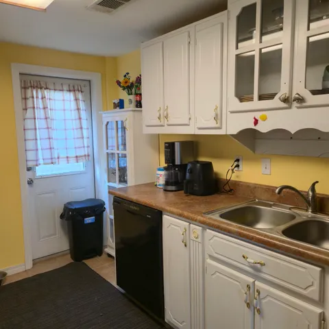 a kitchen with a sink and cabinets