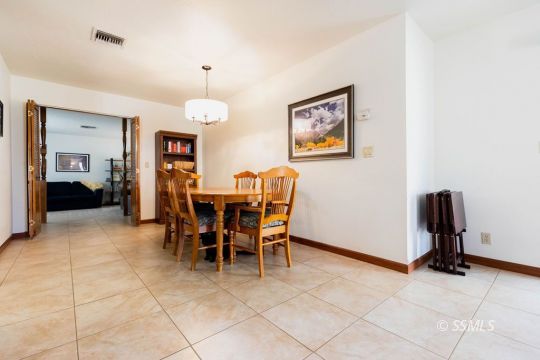 305 South Locust Street Ridgecrest, CA 93555 - Photo 16 of 36 a dining room with furniture and entryway