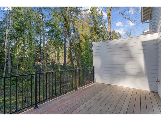 a view of balcony with wooden floor