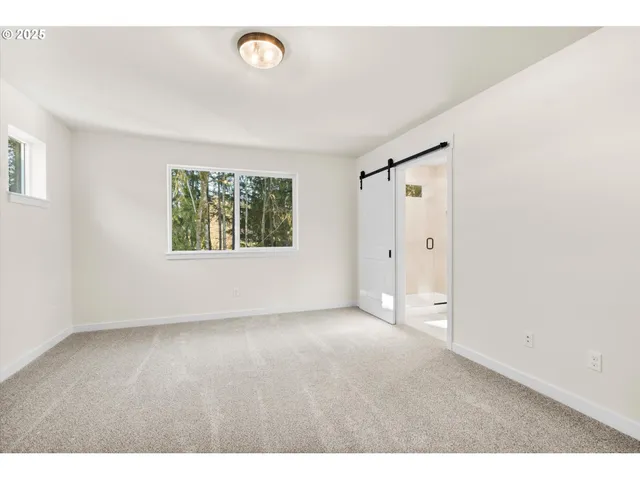 a bathroom with a double vanity sink a mirror and a shower