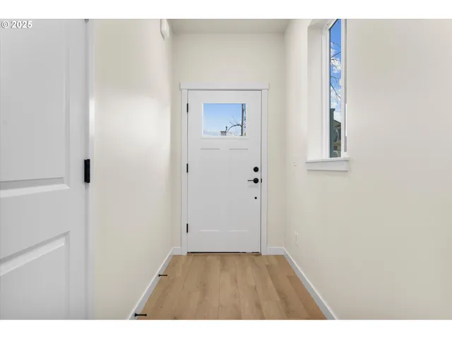a view of a kitchen with electric appliances