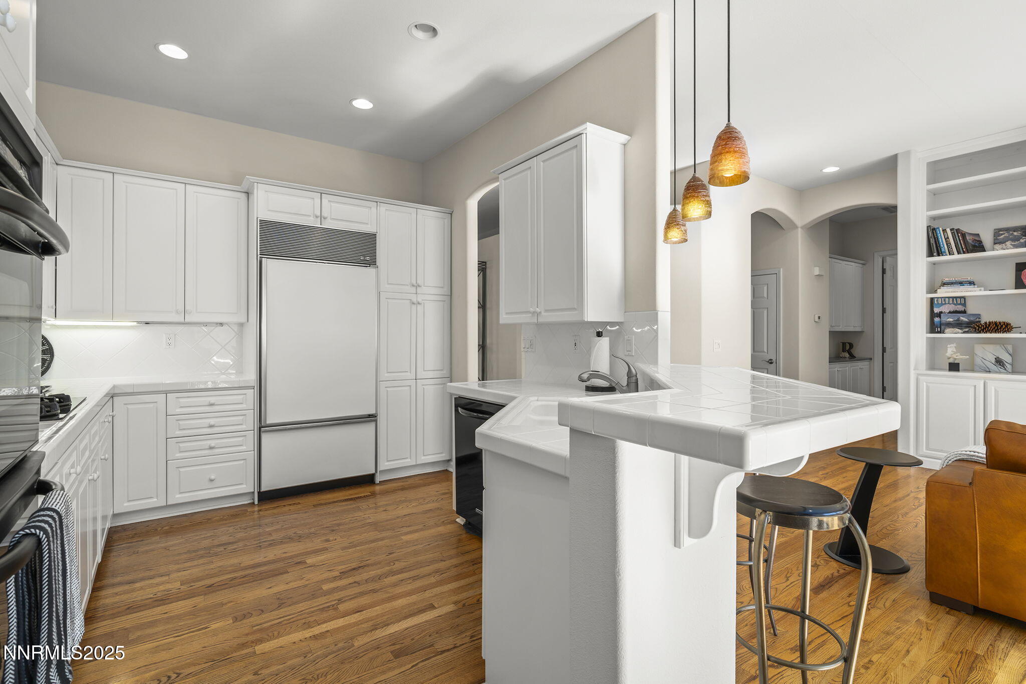 1890 Hunter Creek Road Reno, NV 89519 - Photo 10 of 20 a kitchen with kitchen island a sink appliances and cabinets