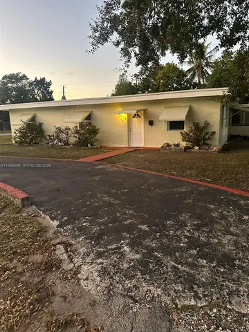 a view of a lake with houses in background