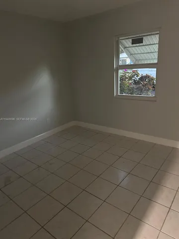 a bath room with a toilet and a bath tub