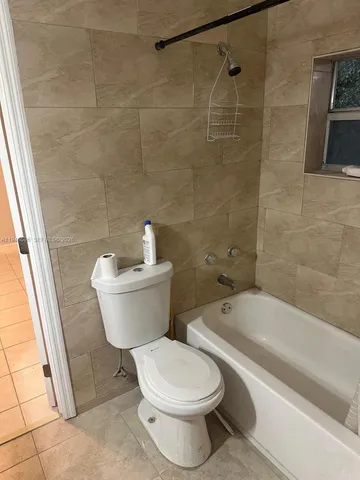 a view of room with window and hardwood floor