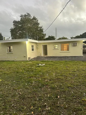 a kitchen with stainless steel appliances granite countertop a sink and a stove top oven