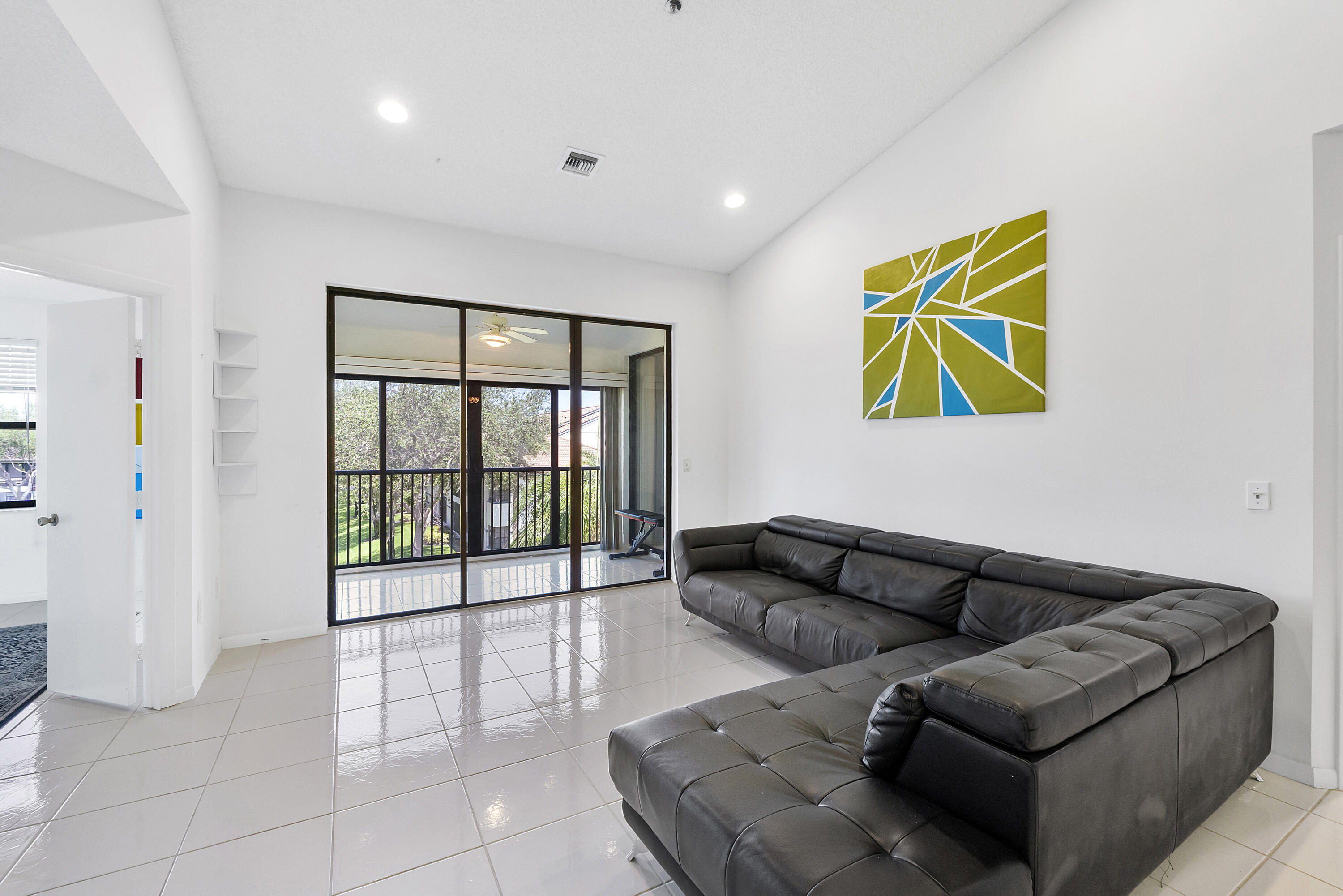 5153 Floria Drive, Unit V Boynton Beach, FL 33437 - Photo 12 of 39 a living room with furniture and a large window