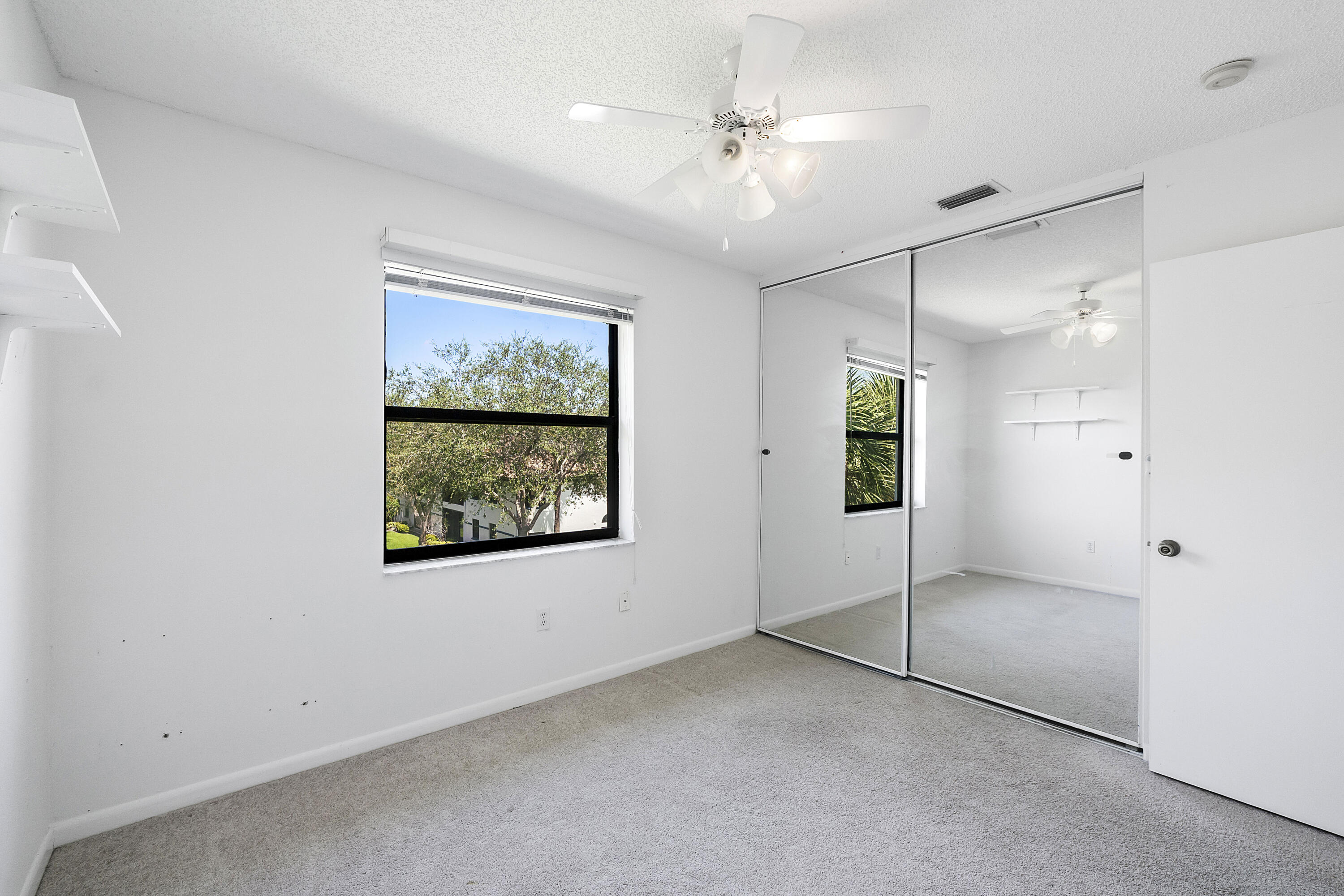 5153 Floria Drive, Unit V Boynton Beach, FL 33437 - Photo 19 of 39 a view of an empty room with a window